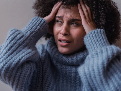 Caught in a moment of uncertainty, a woman's expression reveals the inner struggle of confronting her fears head-on