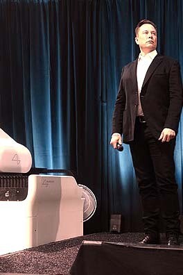 Elon Musk promoting Neuralink; his concerns are not about AI achieving malevolence but about its capacity to outsmart human control