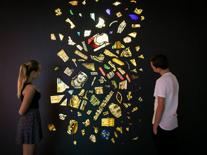Kader Attia, Untitled, 2014, installation view, Kader Attia, Museum of Contemporary Art Australia, Sydney, 2017, 116 stained glass fragments, metal screw hooks and fluorescent fixtures, courtesy of the Rachel and Jean-Pierre Lehmann Collection, image courtesy the artist and Museum of Contemporary Art Australia © the artist, photograph: Anna Kučera