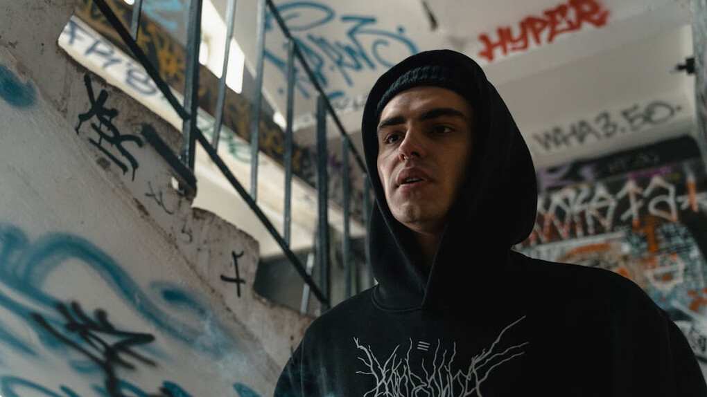 On this graffiti-laden staircase, the contrast between the vivid artwork and the reality of addiction reveals the chasm between celebrity indulgence and the grim struggles of ordinary Australians