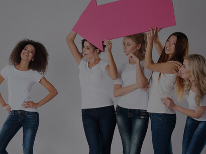 Group of women encouraging and supporting a young woman, symbolizing empowerment and advocacy for girls