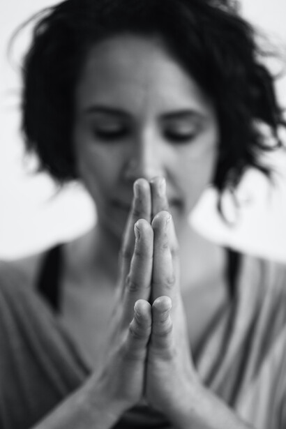 A woman meditates with the universe