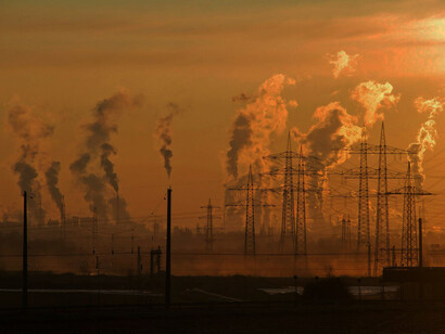 A distant shot of a power facility, fuming