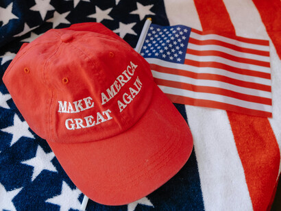 A MAGA hat and an American flag