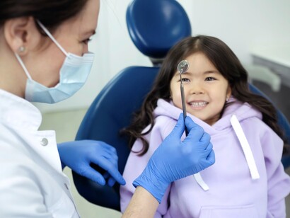 Young girl smiles and is ready for procedure