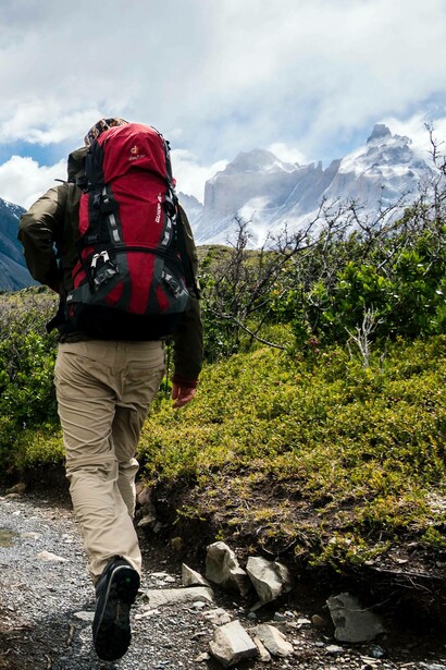Man treks up a mountain