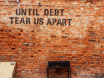 Wall art condemning debt