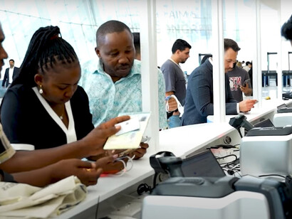 People are entering, investment exhibition at AIM Congress 2024, Abu Dhabi, UAE