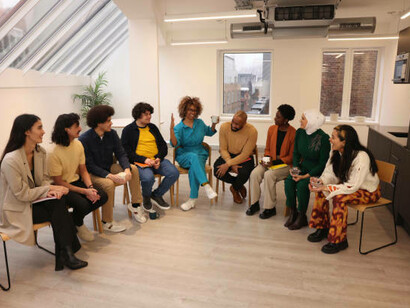 Philosophical discussions on science and spirituality, with people gathered together, engaging in conversation