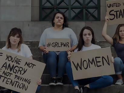 Empowering activism: women championing gender equality and feminism while holding a 'future is female' banner, symbolizing the ongoing fight for women's rights