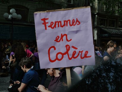 The sign in Paris, France "Femmes en Colère' translates to "Angry Women"