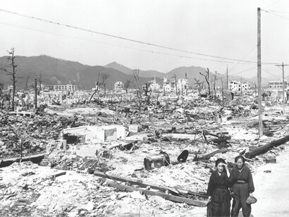 Two women walking among the rubble after the atomic bomb destroyed Hiroshima, Japan in 1945