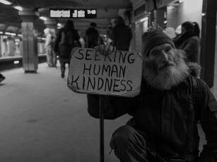A homeless man seeking human kindness