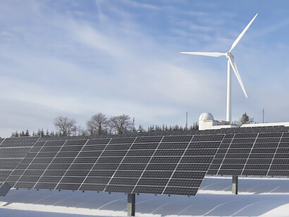 Ontario, Canada transforms into a sustainable winter wonderland, where solar energy panels gracefully rise from the snow-covered ground, symbolizing the harmonious integration of clean energy in the serene northern landscape