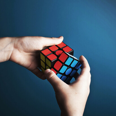 A Rubik's cube; Aristotle's “methodos,” or method of inquiry, revolves around archai, suggesting that to understand any complex system, one must first understand its fundamental building blocks