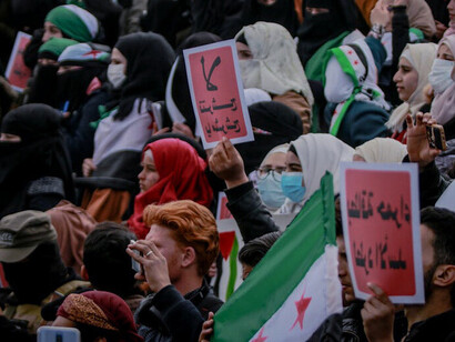 Against a backdrop of destruction, the determination of these individuals symbolises hope and resilience, advocating for a future free from violence