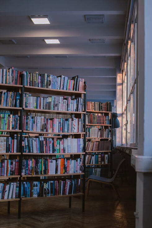 Amidst the hushed whispers of pages turning, a sanctuary of learning emerges, where the pursuit of universal essence transcends the confines of earthly plans