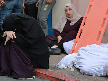 Palestinians transport the injured to the Indonesian Hospital in Jabalia, north of the Gaza Strip on October 9, 2023