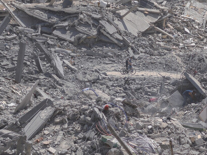 The remnants of a once-thriving neighborhood in Gaza, reduced to rubble by the ongoing conflict, symbolise the enduring struggle and devastation faced by its people