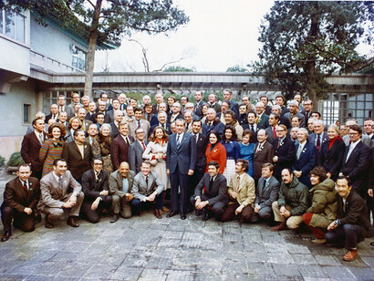 President Nixon takes a picture with members of the press corps