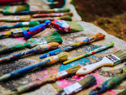 An assortment of paintbrushes; Kant believes that natural objects are lovely to aesthetic perception when they are seen as having a purposeless purposiveness.