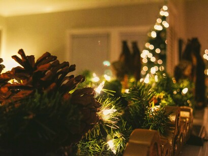 A Christmas tree adorned with string lights captures the festive spirit, reflecting holiday traditions, joyful decorating, and the essence of a happy holiday season