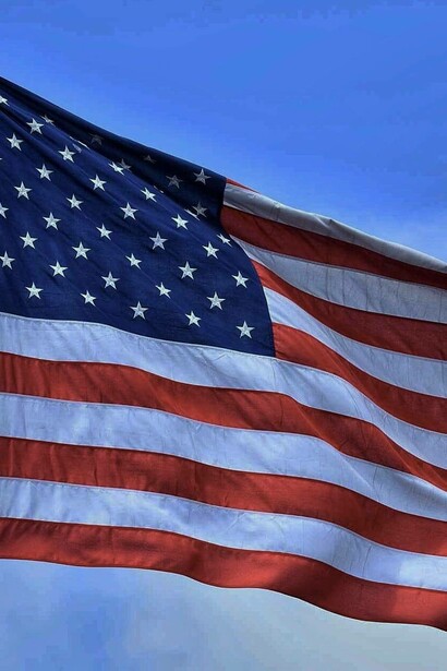 American flag waving in the sky