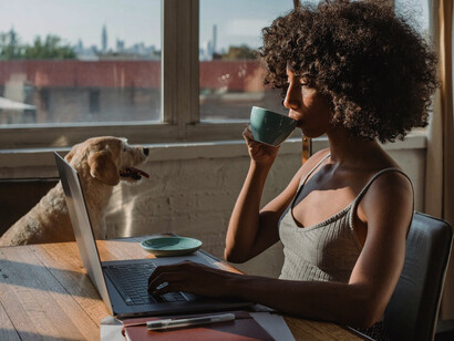 As she works diligently on her laptop, this introspective woman contemplates the complexities of feminism and societal expectations, finding strength in her journey towards personal liberation
