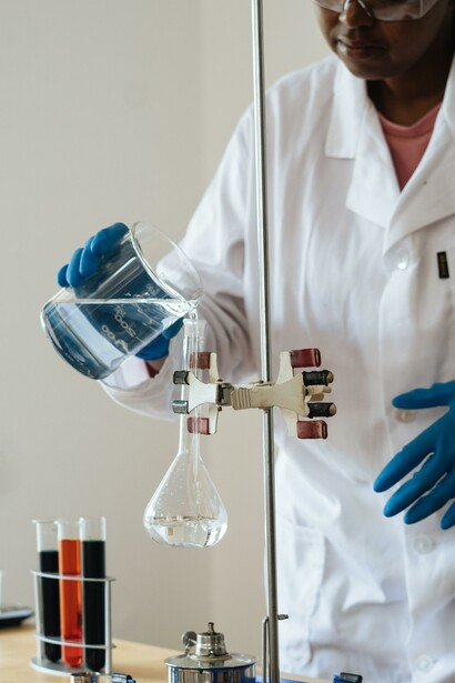 A person in a lab coat researching synthetic biology