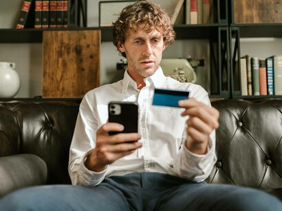 Man using credit card on an e-commerce website