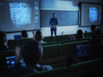 Young university professor explaining quantum information theory, stochastic resonance, multidimensional scaling, and quantum computing