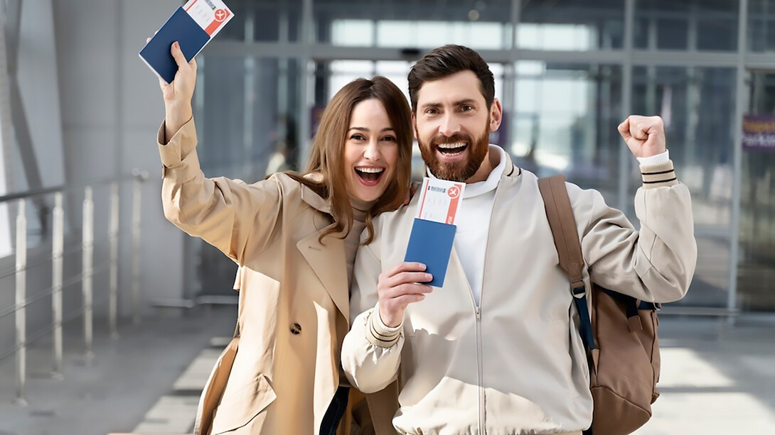 Happy couple with documents and passports preparing to move abroad as expats