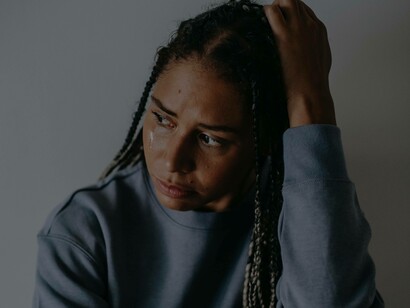 A woman in tears after having been through the storm of a difficult situation