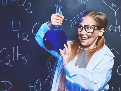 Happy little scientist making experiment