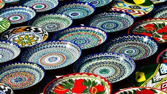 Colorful traditional mosaic plates crafted by local artisans in Bukhara, Uzbekistan