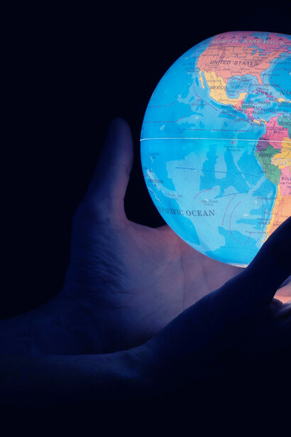 A fluorescent globe representing global citizens