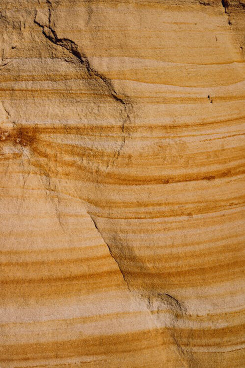 Just as sandstone reveals its intricate layers over time, the question "Why?" uncovers deeper insights into the complexities of our world, urging us to explore beyond surface-level understanding and embrace the richness of inquiry