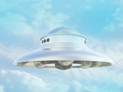 An unidentified flying object (UFO) soared in the blue sky among the clouds