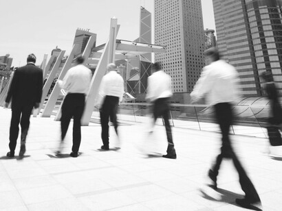 Business professionals in motion, a testament to humanity's inherently social nature