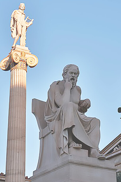 The statues of Socrates and Apollo Citharoedus by the Greek sculptor Leonidas Drosis (1836-1882) in the gardens of the Academy of Athens, Greece