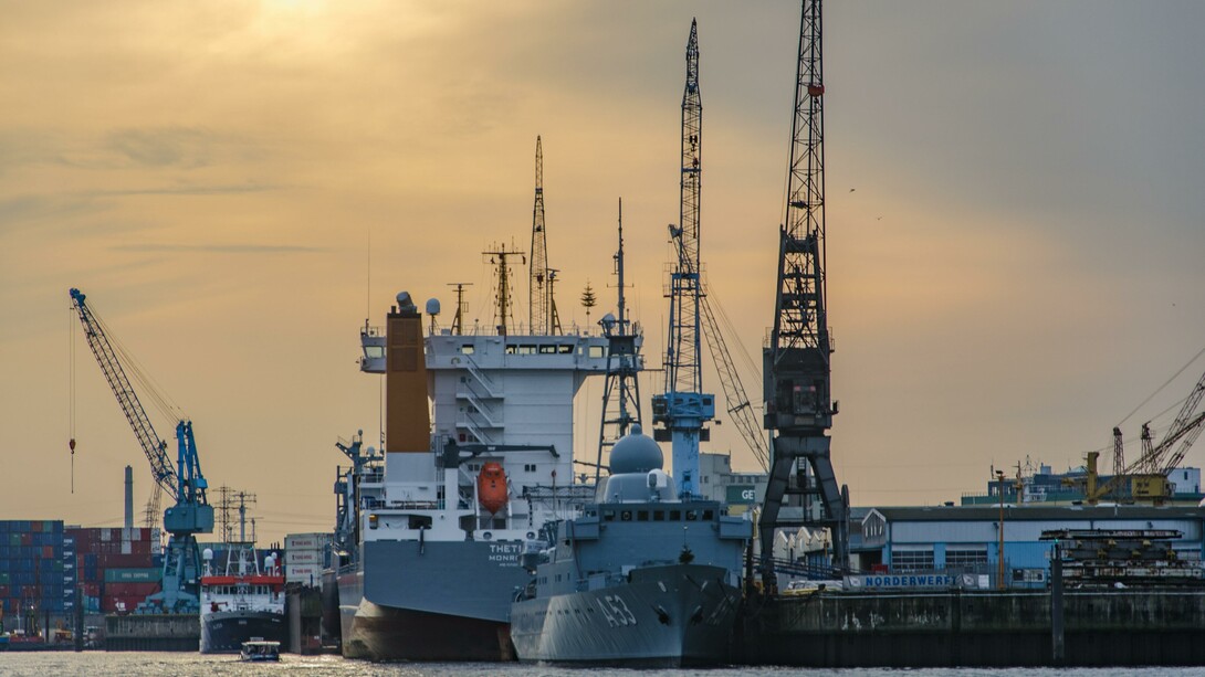 A shipping boat near dock before sunset