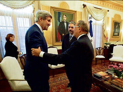 The then Dominican Republican President Danilo Medina shakes hands with then U.S. Secretary of State John Kerry on the 14th of June, 2016, at the Presidential Palace in Santo Domingo, Dominican Republic