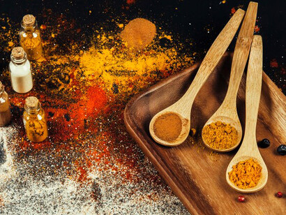 Indian spices are showcased on a table, highlighting the key components used in traditional Indian food preparation