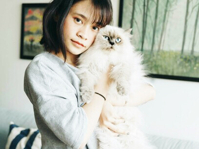 A woman finding solace in bonding with her pet