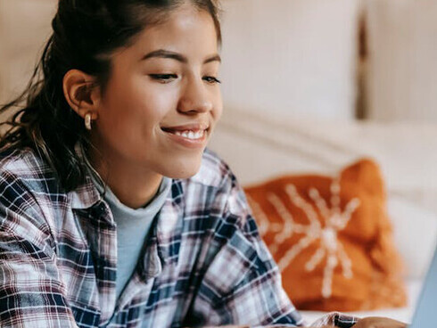 A mix of happiness and longing washes over her as she smiles at the screen, remembering the laughter and support that made every interaction special