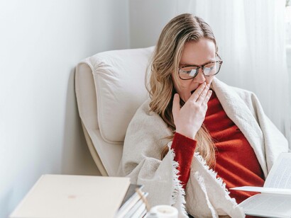 Woman yawning during the day