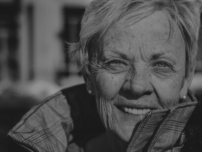 A senior woman with a radiant smile