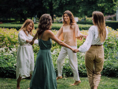 Dancing among blossoms, these women embrace the power of positive thoughts, their minds bloom as they sway to the rhythm of renewal