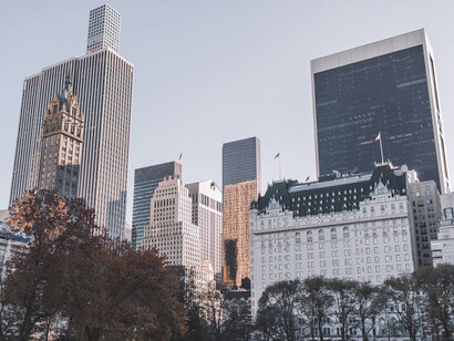 Skyscrapers rise majestically against the skyline, creating a breathtaking backdrop that captures the essence of ambition and dreams in the heart of Manhattan, New York City