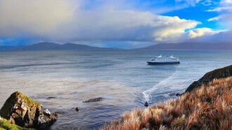 A cruise ship passing through the waters of Cape Horn, Chile, reflecting the region’s pivotal position at the southern tip of South America